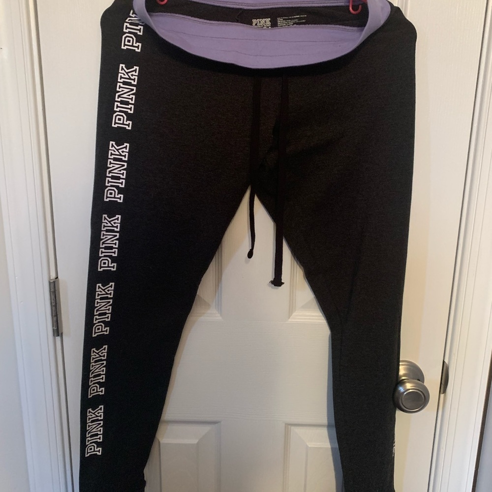Pink. Yoga pants. Dark gray/black with purple band and white lettering. Medium